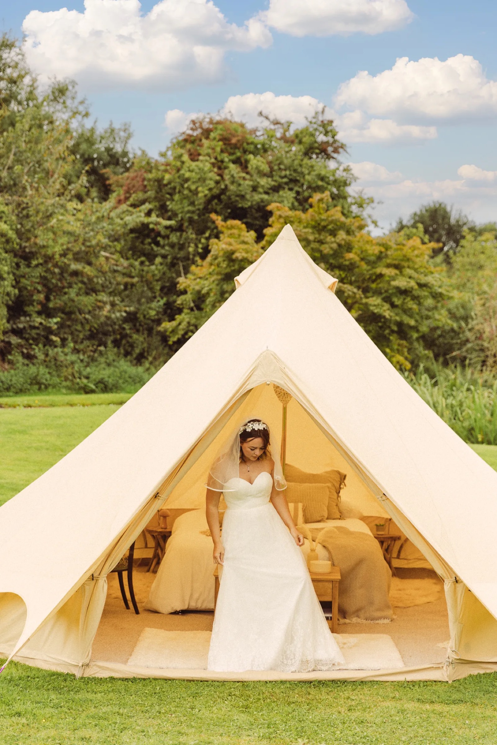 Bell tent village set up in a large garden near Bristol