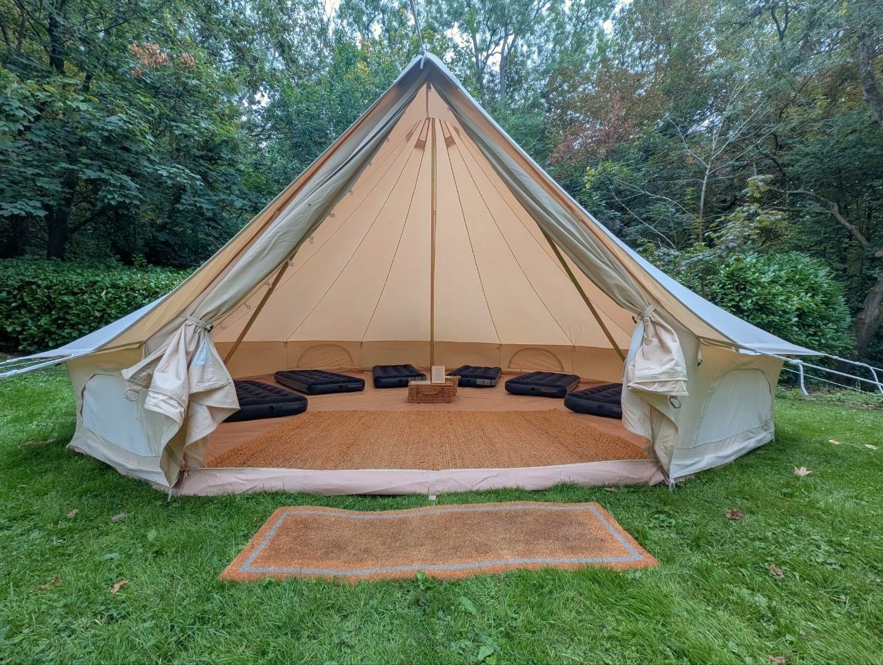 Wide open Rustic Bell tent with airbeds, woven matting and canvas interior