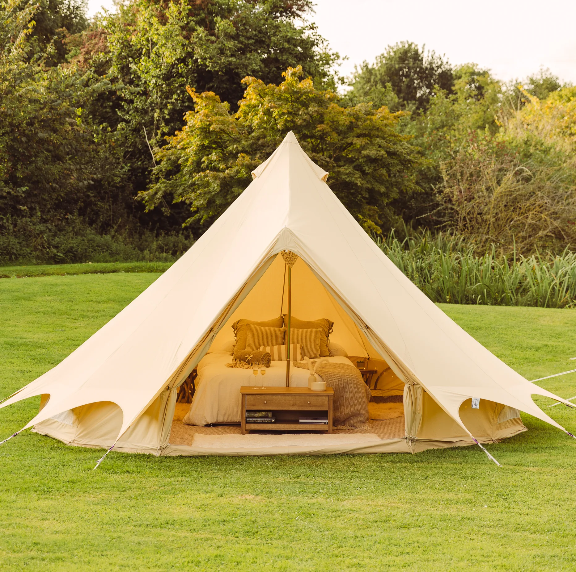 Camp Chic bell tents lit for an evening event