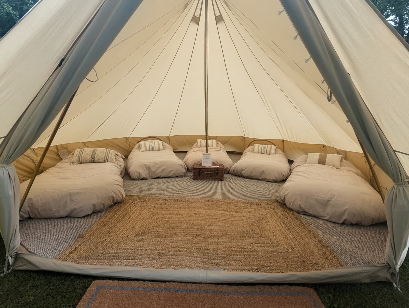 Rustic Camp Chic bell tent guest accommodation with single air beds in Sherrington Wiltshire