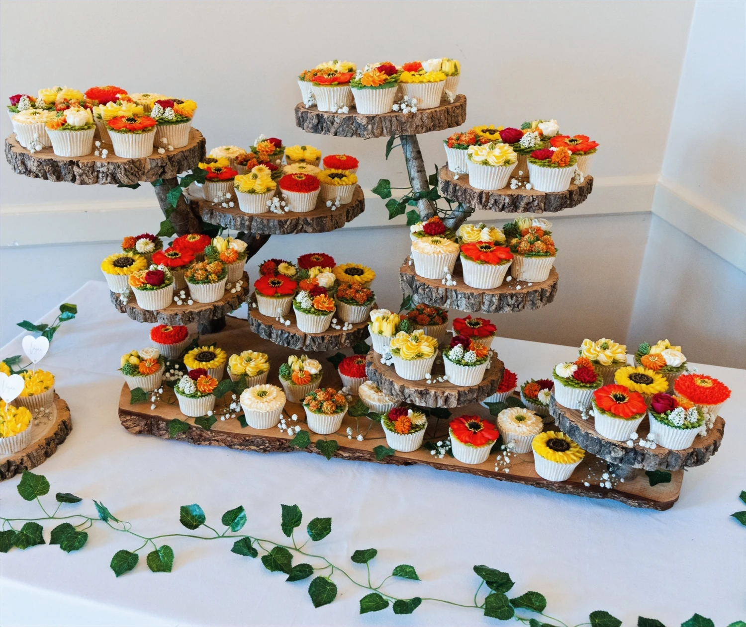 Wedding cake display from Donna’s Floral Cakery portfolio
