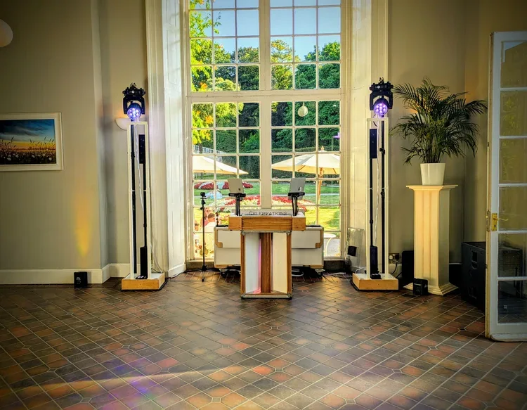 DJ setup in a bright reception room
