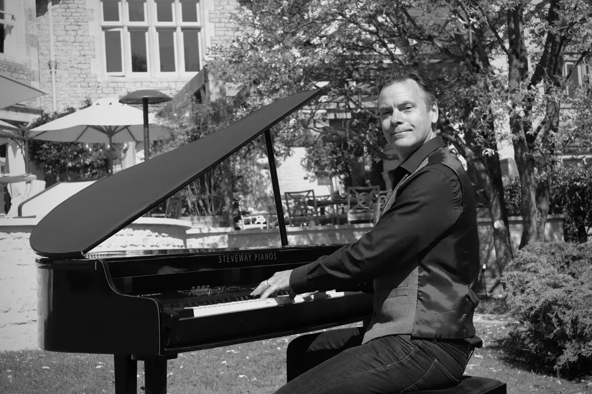 Pianist at a mini-grand piano