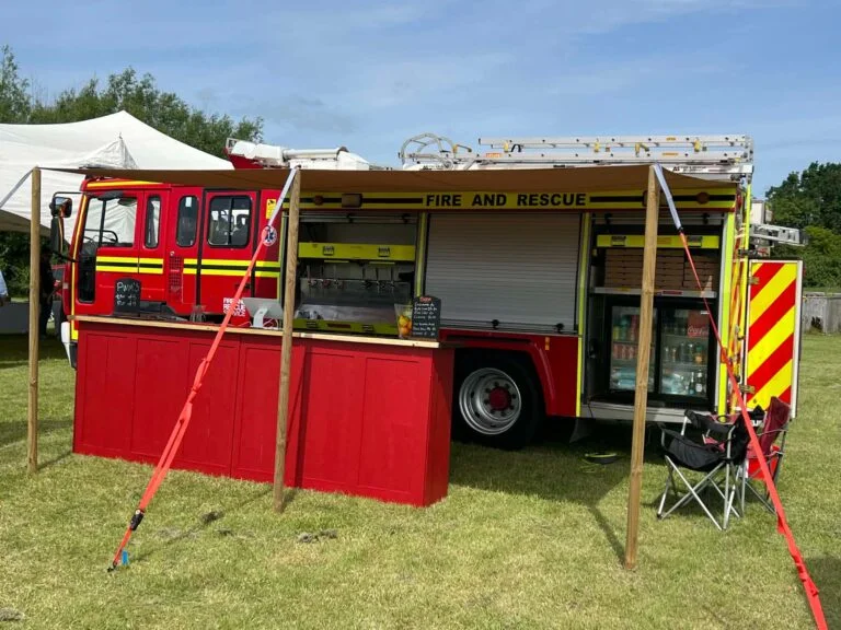 Converted fire engine mobile pizza and bar setup
